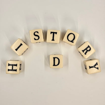 Cubes with letters spelling 'HISTORY' on a light background