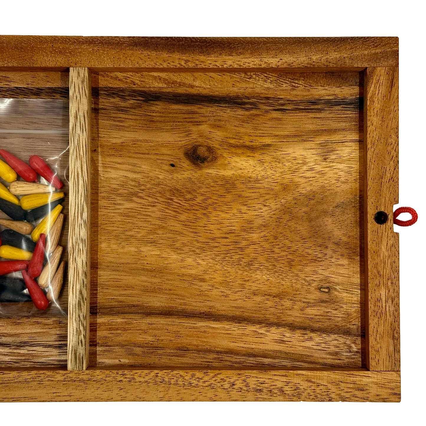 Back of wooden Cribbage board with colorful pieces stored inside