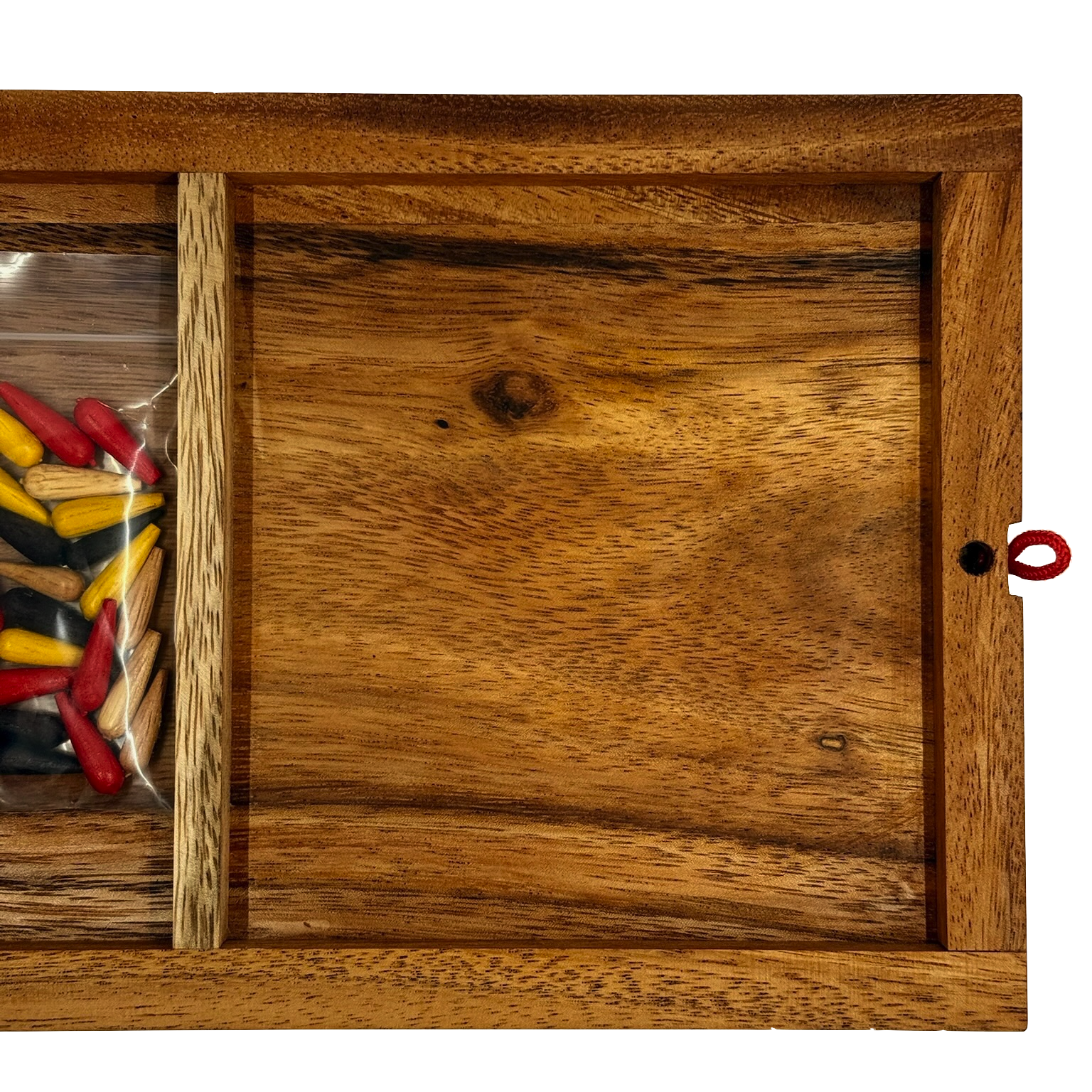 Back of wooden Cribbage board with colorful pieces stored inside