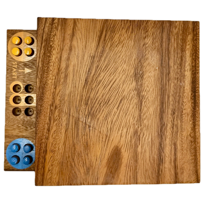 Wooden Ludo board game with colorful pieces on a white background