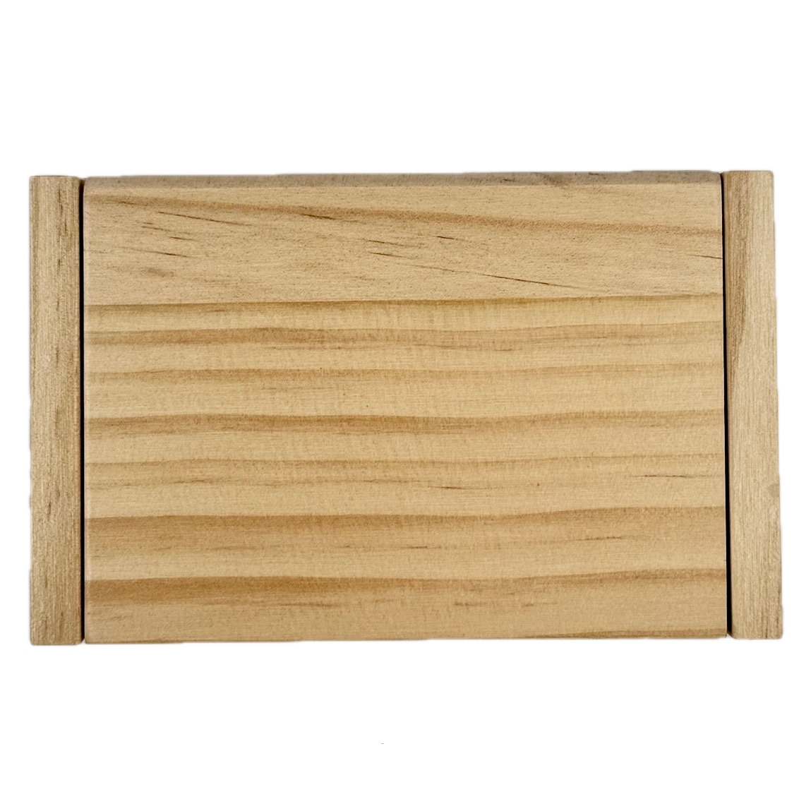 Miniature wooden Shut the Box game on a white background