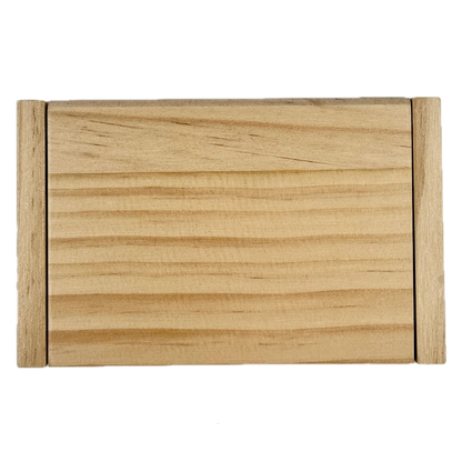 Miniature wooden Shut the Box game on a white background