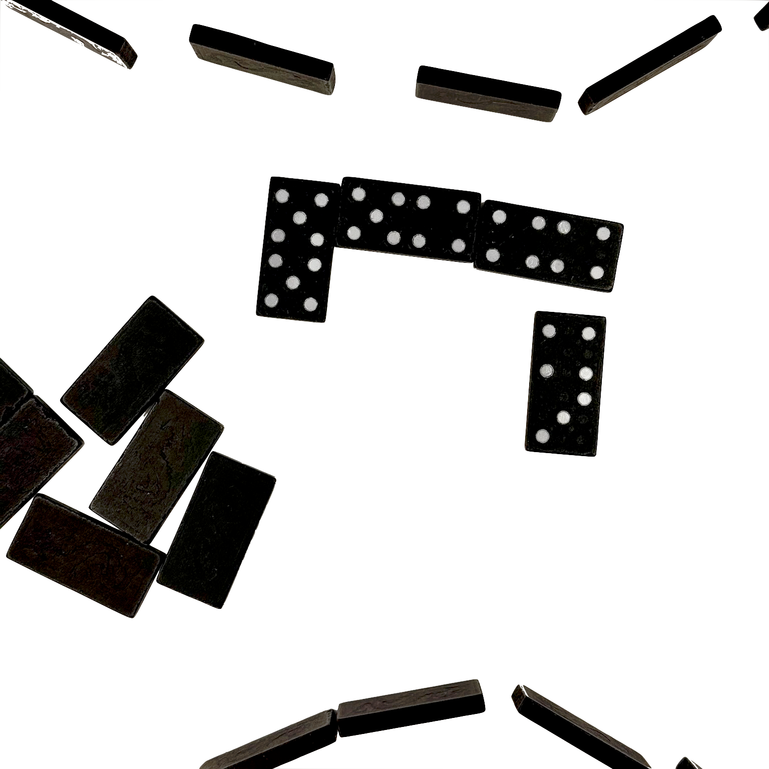 Black dominoes with white dots scattered on a white background