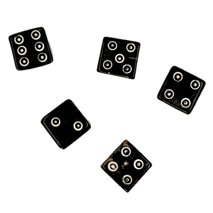 Five black horn dice with circular patterns on a white background