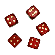 Five red wood dice with gold dots on a white background