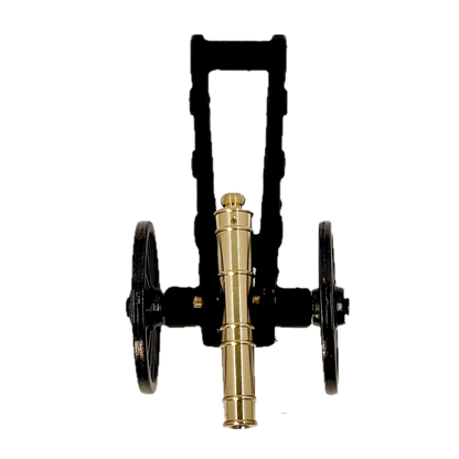 Brass replica Trail Cannon toy on a white background