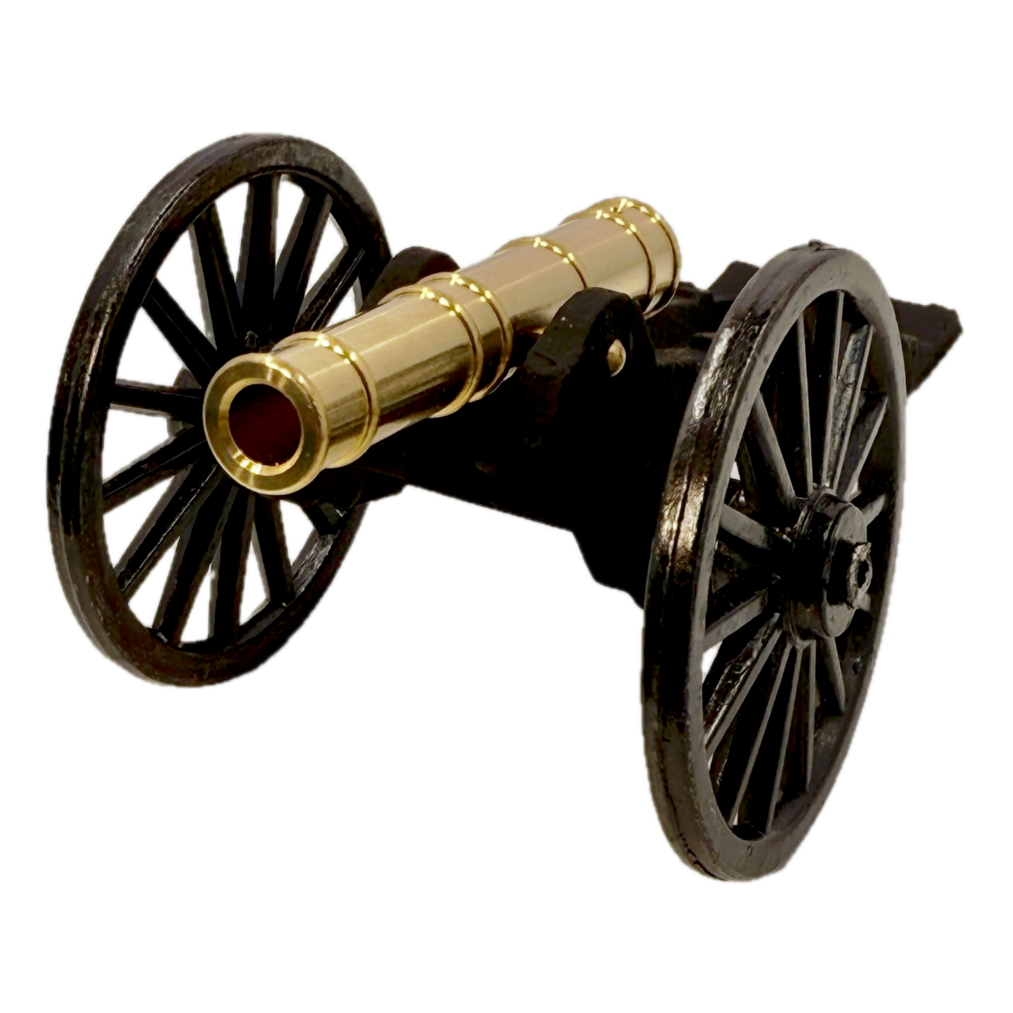 Brass replica Trail Cannon toy on a white background