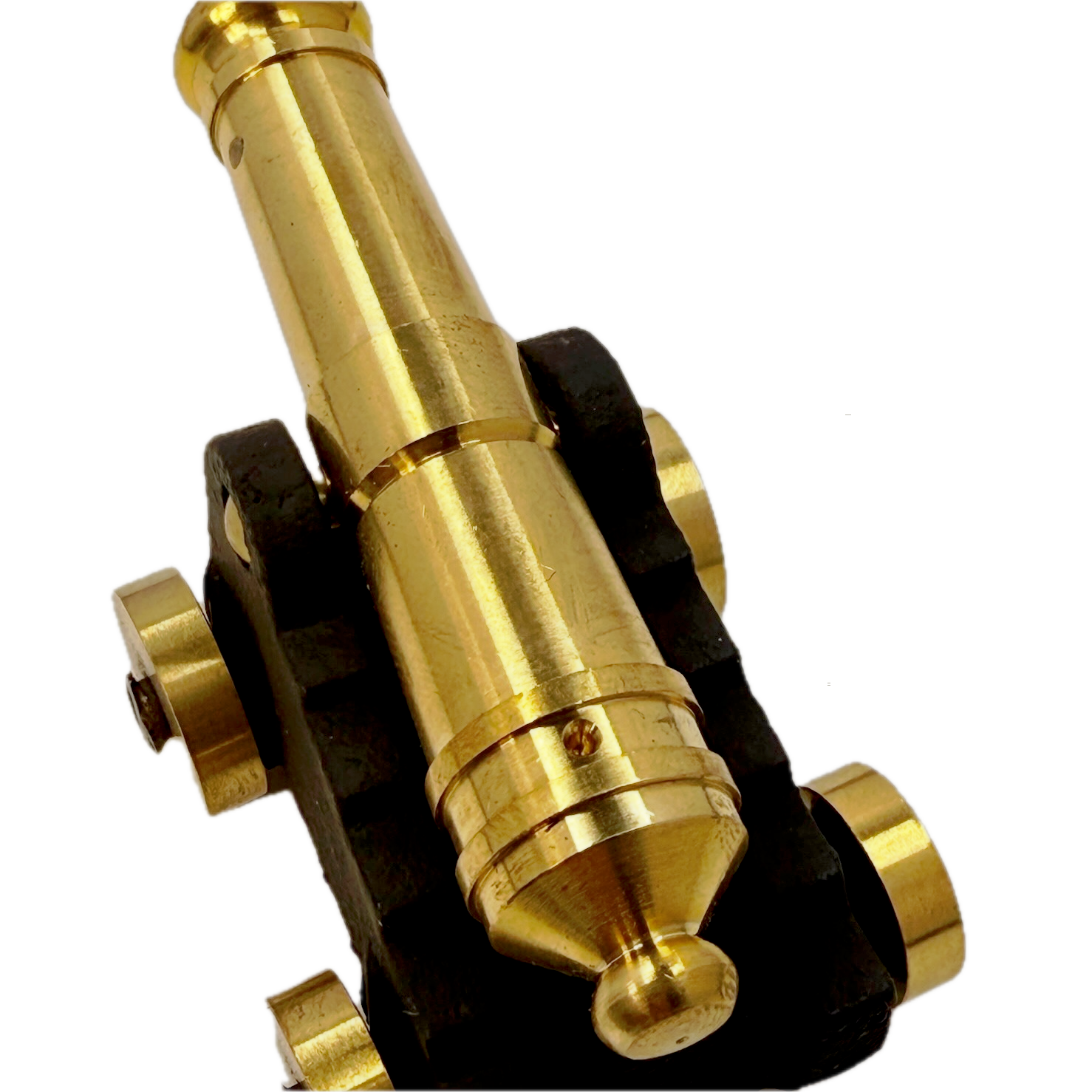 Close-up of a brass replica ship cannon on a white background
