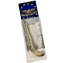 Packaged toy replica flintlock pistol in packaging on a white background