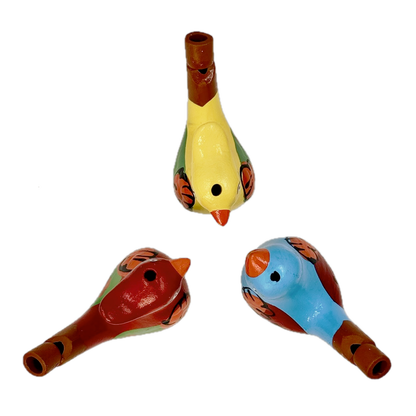 Three colorful bird-shaped whistles on a white background
