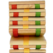Jacob's Ladder toy with colorful ribbon bindings on a white background