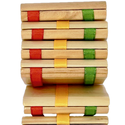 Jacob's Ladder toy with colorful ribbon bindings on a white background