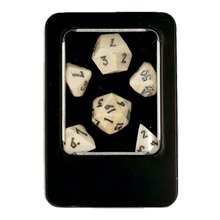 Set of six polyhedral bone dice with numbers in a black box