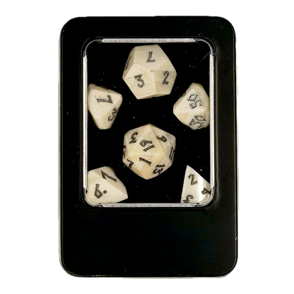 Set of six polyhedral bone dice with numbers in a black box