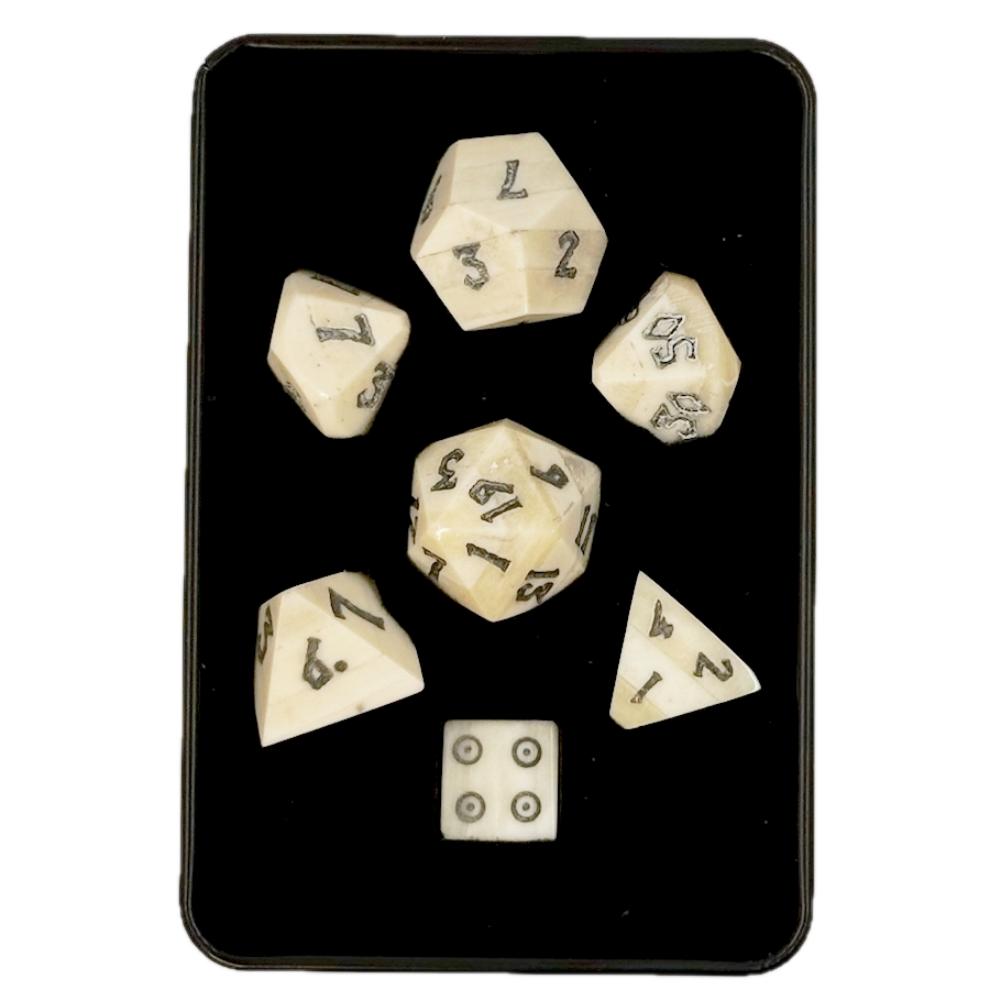 Set of polyhedral bone dice with white faces and black numbers in a black box
