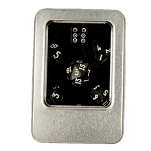 Metal dice case with polyhedral horn dice inside on a white background