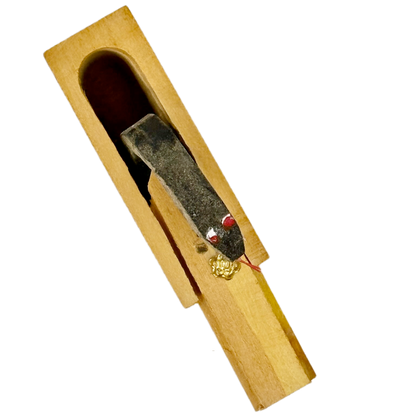 Small wooden Snake in the Box toy on a white background