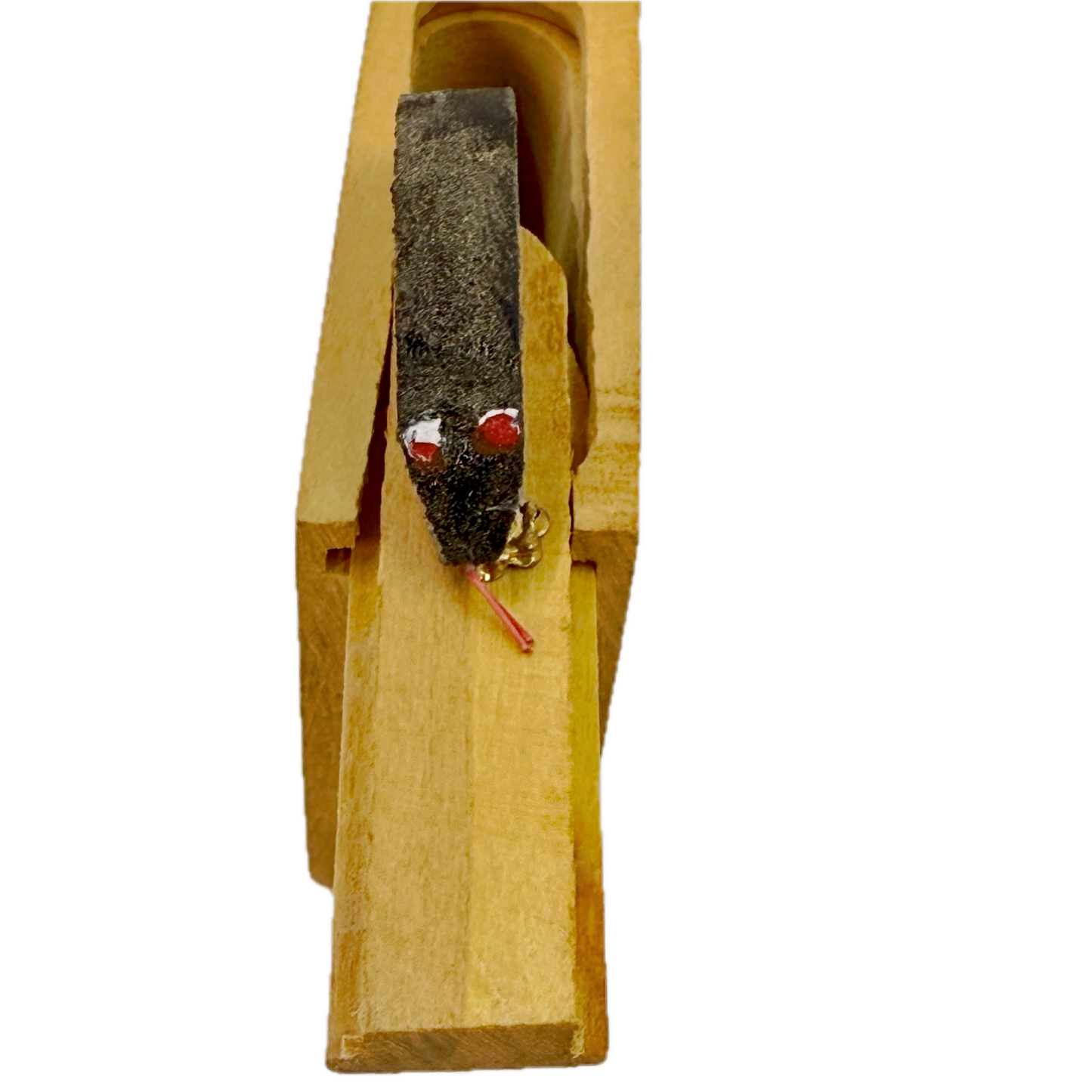 Small wooden Snake in the Box toy on a white background