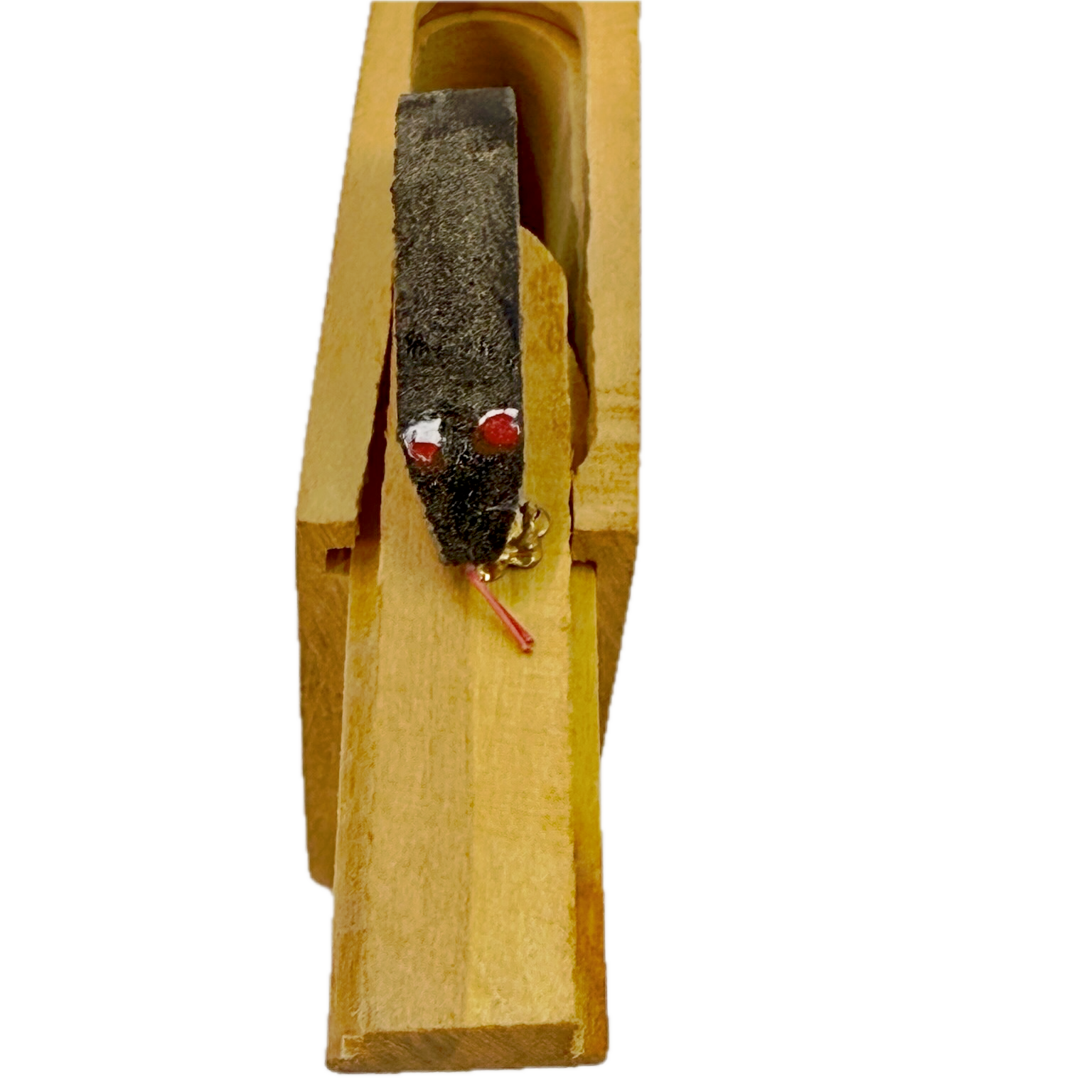 Small wooden Snake in the Box toy on a white background