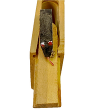 Small wooden Snake in the Box toy on a white background