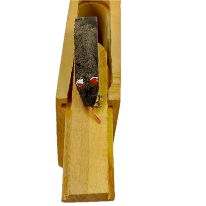Small wooden Snake in the Box toy on a white background