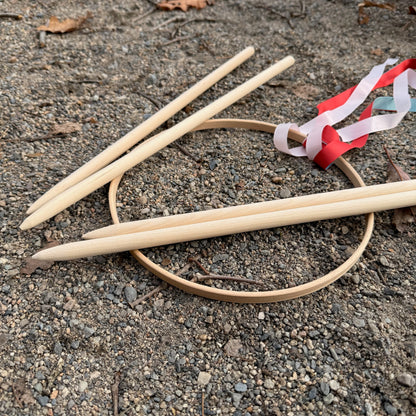 Wooden Graces game on a gravel surface