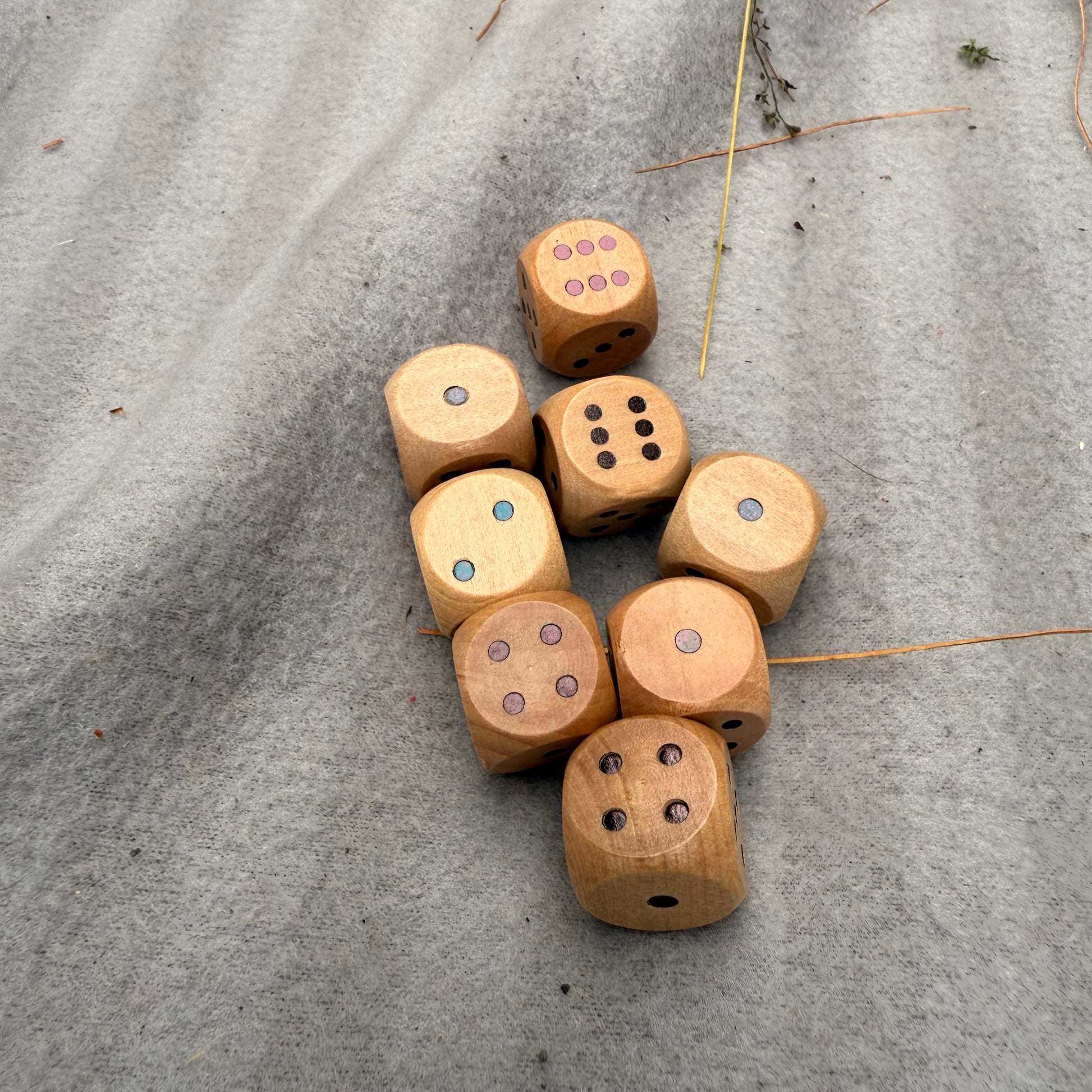 Wooden dice on a gray surface